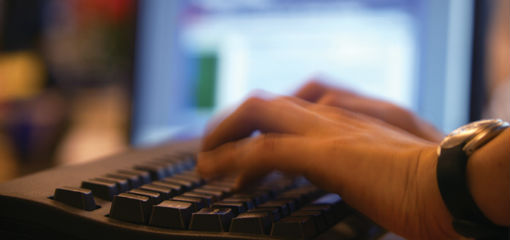 person using computer keyboard