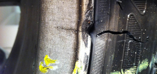 tyre and rim with pothole damage