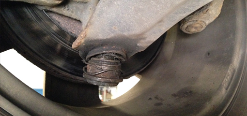 a front suspension ball joint completely separated from the lower suspension arm