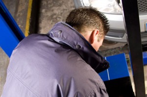 MOT tester testing a car headlamp