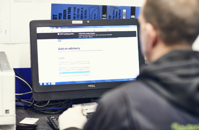 MOT tester looking at the advisories screen on the MOT testing service.