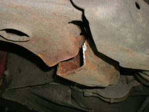 A badly cracked car wishbone