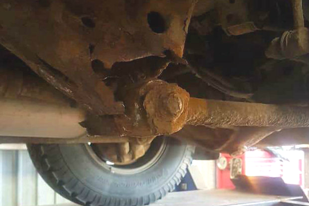 corroded chassis mounting point on nearside rear trailing arm