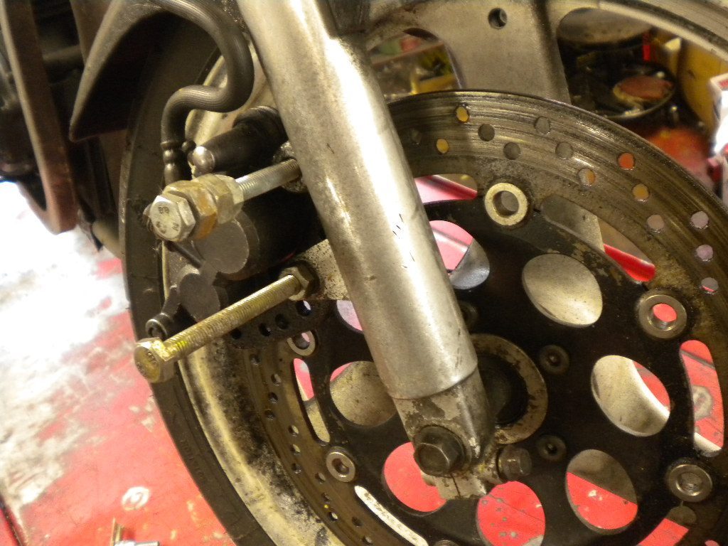 Bolts sticking out of motorcycle wheel